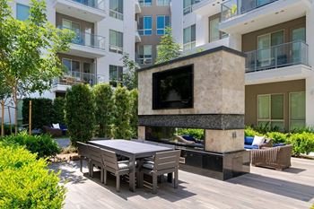 Open-air loggia with large screen tv's and cozy seating area